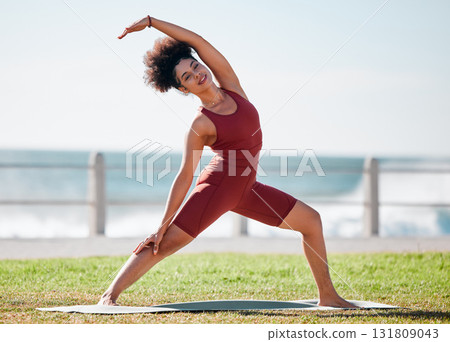 Fitness, stretching and black woman for yoga on grass for healthy lifestyle, body wellness and cardio workout. Sports, pilates and girl doing meditation, training and exercise for zen, peace and calm 131809043