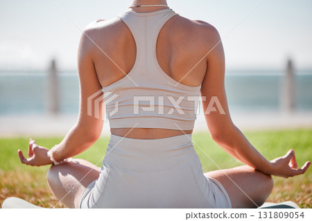 Yoga, lotus pose and woman from behind in park or beach for zen fitness, exercise and mindfulness, healing and peace. Meditation, nature and calm person with mental health in nature for body wellness Yoga, lotus pose and woman from behind in park or beach for zen fitness, exercise and mindfulness, healing and peace. Meditation, nature and calm person with mental health in nature for body wellness 131809054