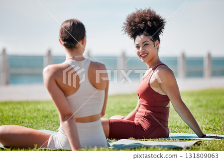 Yoga, park and couple of friends or women talking of fitness, exercise and wellness class in diversity and support. Happy black woman or people with zen, health and holistic sports together in nature 131809063