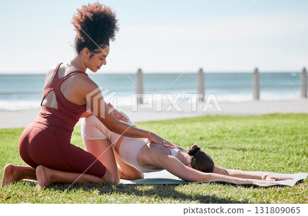 Help, fitness and women doing yoga at park for a warm up, exercise and stretching support in Spain. Health, training and personal trainer with a girl for flexibility during pilates workout in nature Help, fitness and women doing yoga at park for a warm up, exercise and stretching support in Spain. Health, training and personal trainer with a girl for flexibility during pilates workout in nature 131809065