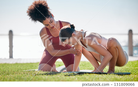 Yoga class, personal trainer or women support, helping and learning balance, training and exercise on beach or park. Coaching black woman with pilates workout on grass for sports and body wellness Yoga class, personal trainer or women support, helping and learning balance, training and exercise on beach or park. Coaching black woman with pilates workout on grass for sports and body wellness 131809066