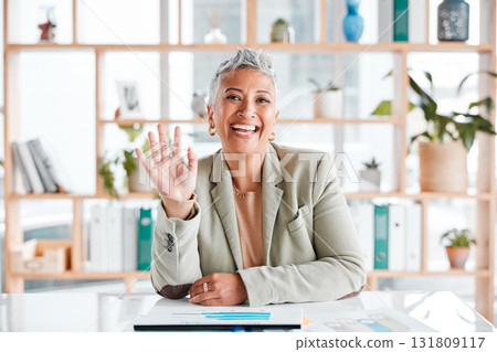 Senior woman portrait, wave and virtual business meeting call with a corporate ceo ready for working. Office, market research data and mature management employee waving for a greeting and welcome 131809117