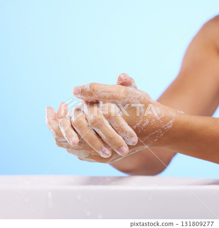 Soap, girl or washing hands in studio on blue background for wellness or healthy skincare hydration. Healthcare mockup, body care zoom or woman cleaning with liquid for hygiene or bacteria prevention Soap, girl or washing hands in studio on blue background for wellness or healthy skincare hydration. Healthcare mockup, body care zoom or woman cleaning with liquid for hygiene or bacteria prevention 131809277