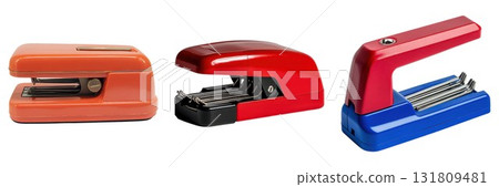 Three colorful desk staplers for office supplies isolated on white background 131809481