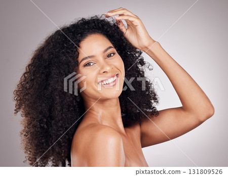 Skincare, beauty and portrait of a woman in a studio with a natural, cosmetic and face routine. Health, wellness and female model from Puerto Rico with a facial treatment isolated by gray background. Skincare, beauty and portrait of a woman in a studio with a natural, cosmetic and face routine. Health, wellness and female model from Puerto Rico with a facial treatment isolated by gray background. 131809526