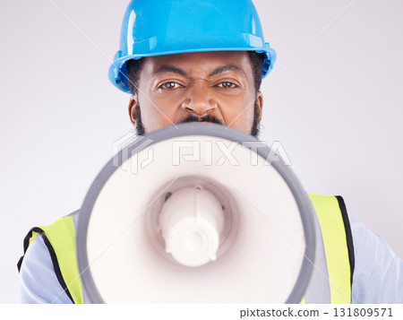 Engineering black man, megaphone and construction in studio portrait for angry shouting by white background. Engineer, architect or manager with loudspeaker in workplace with anger on frustrated face Engineering black man, megaphone and construction in studio portrait for angry shouting by white background. Engineer, architect or manager with loudspeaker in workplace with anger on frustrated face 131809571
