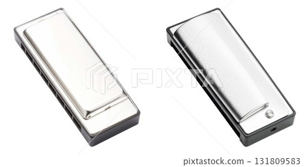 Two harmonicas shiny metal pocket musical instruments isolated on white background 131809583