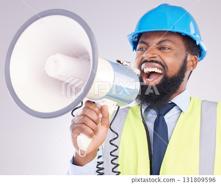 Engineer black man, megaphone and construction in studio portrait for angry shouting by white background. Engineering, architect or manager with loudspeaker in workplace with anger on frustrated face Engineer black man, megaphone and construction in studio portrait for angry shouting by white background. Engineering, architect or manager with loudspeaker in workplace with anger on frustrated face 131809596