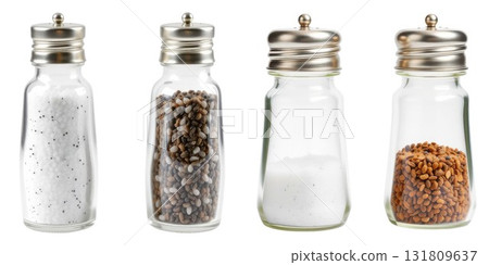 Four glass shakers filled with salt and spices for cooking isolated on white background 131809637