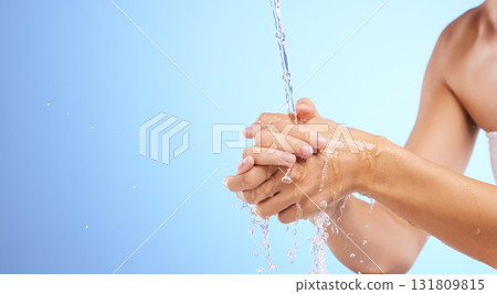Water, girl or washing hands in studio on blue background for wellness or skincare hydration. Healthcare mockup, body care zoom or woman cleaning with liquid splash for hygiene or bacteria prevention 131809815