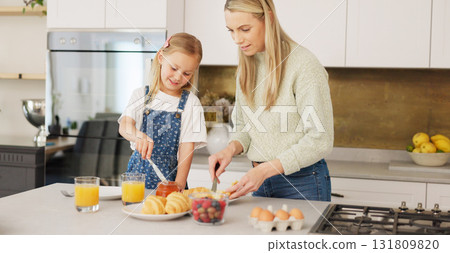 Love, food and mother with girl in a kitchen for breakfast, learning and help in their home. Fruit, cooking and kid with mom in a house for meal, teaching and child development bonding on the weekend Love, food and mother with girl in a kitchen for breakfast, learning and help in their home. Fruit, cooking and kid with mom in a house for meal, teaching and child development bonding on the weekend 131809820