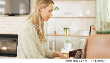 Woman, piano and music with pianist, training and creativity with art, performance and contemporary at home. Classical, concert and symphony preparation with lady playing musical instrument and relax 131809832