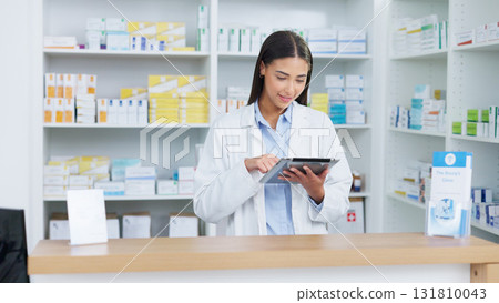 Healthcare, tablet and woman pharmacist doing research at dispensary for prescription medication. Medical, digital technology and female chemist check stock inventory for medicine in drugstore clinic 131810043