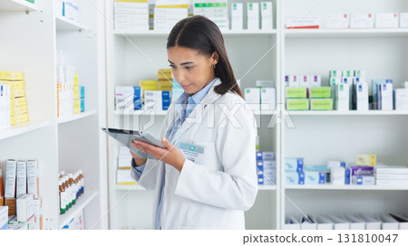 Medicine, tablet and woman pharmacist doing research at dispensary for prescription treatment. Medical, digital technology and female chemist check stock inventory for medication in drugstore clinic. 131810047