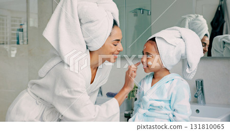 Home spa, mother and child doing morning skincare and cleaning with family product for dermatology and cosmetic. Woman, girl and happy for wellness, health and skin cream or mask in bathroom Home spa, mother and child doing morning skincare and cleaning with family product for dermatology and cosmetic. Woman, girl and happy for wellness, health and skin cream or mask in bathroom 131810065