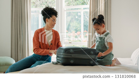 Mother, child and suitcase for travel in home bedroom together and ready for family vacation trip. African woman or parent and girl kid relax on hotel bed with clothes or luggage for holiday getaway Mother, child and suitcase for travel in home bedroom together and ready for family vacation trip. African woman or parent and girl kid relax on hotel bed with clothes or luggage for holiday getaway 131810068