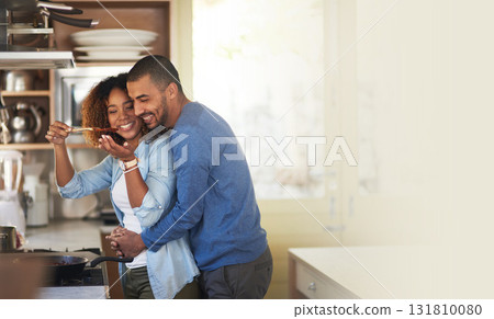 Cooking, black couple and hug in a kitchen with marriage and love at home with mockup. Dinner, food taste and happy woman and man together with care in a house with mock up and happiness from eating 131810080