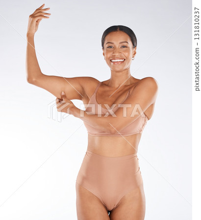 Health, muscle flex and portrait of black woman on white background with smile, body wellness and beauty. Fitness, exercise and girl excited for weight loss, healthy lifestyle and progress in studio 131810237