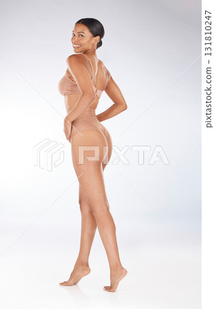 Health, fitness and portrait of a woman in underwear isolated on a grey studio background. Beauty, confidence and happy model in lingerie for promotion, empowerment and body positivity on a backdrop Health, fitness and portrait of a woman in underwear isolated on a grey studio background. Beauty, confidence and happy model in lingerie for promotion, empowerment and body positivity on a backdrop 131810247
