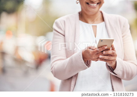 Woman, hands and phone in city for social media, communication or chatting and texting. Hand of female with smile on smartphone for 5G connection, talking or networking in road of an urban town Woman, hands and phone in city for social media, communication or chatting and texting. Hand of female with smile on smartphone for 5G connection, talking or networking in road of an urban town 131810273