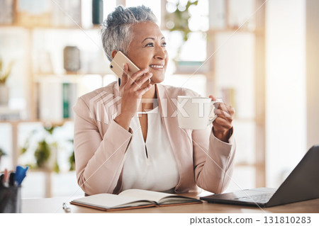Senior woman, phone call and coffee by laptop in communication, conversation or discussion at office desk. Elderly female on smartphone smiling with cup talking about business idea plan or networking 131810283
