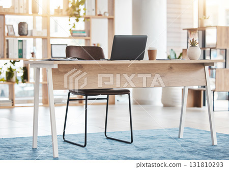 Interior design, furniture and laptop in workspace, room and desk for professional aesthetic, productivity or goal. Home office, table and computer in workplace, house or apartment for working on web 131810293
