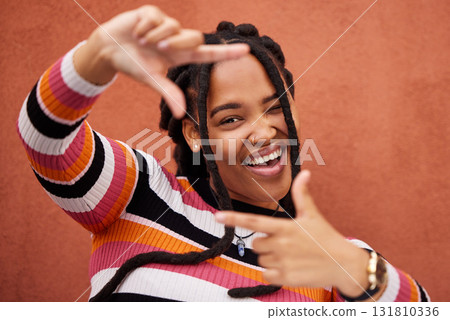 Finger framing, portrait and black woman on background for profile picture in Nigeria. Face, happy female and hands frame perspective, selfie and vision of happiness, smile and photography in studio Finger framing, portrait and black woman on background for profile picture in Nigeria. Face, happy female and hands frame perspective, selfie and vision of happiness, smile and photography in studio 131810336