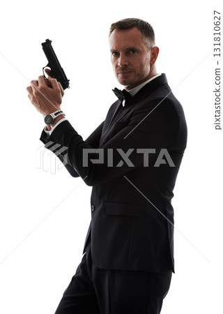 Secret agent man with gun isolated on a white background for law, action movie or security of a criminal businessman. Private detective, professional person crime or actor firearm in studio portrait 131810627