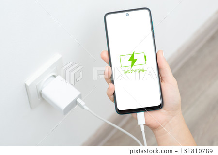 Fast charging of mobile smartphone with USB Type-C. Modern technologies, hi-tech devices, consumption of electricity 131810789