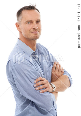 Confidence, pride and portrait of a man in a studio posing with crossed arms for leadership. Happy, smile and face of a confident mature male model with positive mindset isolated by white background. Confidence, pride and portrait of a man in a studio posing with crossed arms for leadership. Happy, smile and face of a confident mature male model with positive mindset isolated by white background. 131810841