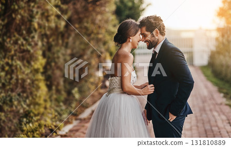 Love, wedding and couple with smile in garden for marriage, ceremony celebration and commitment. Affection, trust and bride and groom hug, embrace and happy for romance, bonding and loving in park 131810889