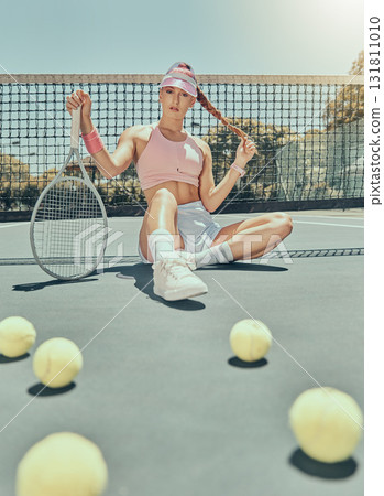 Portrait, tennis sports and woman on court with racket after workout, training or exercise. Fashion, fitness balls or female athlete sitting, resting or relax on stadium outdoors after match or game Portrait, tennis sports and woman on court with racket after workout, training or exercise. Fashion, fitness balls or female athlete sitting, resting or relax on stadium outdoors after match or game 131811010