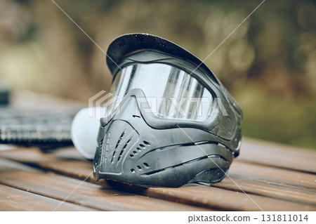 Helmet, paintball and sports with equipment on a table outdoor for military or army training on a battlefield. Safety, exercise and mask with combat accessories on a wooden surface for war simulation Helmet, paintball and sports with equipment on a table outdoor for military or army training on a battlefield. Safety, exercise and mask with combat accessories on a wooden surface for war simulation 131811014