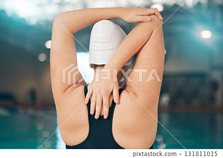 Fitness, sports and stretching with woman at swimming pool for training, health and cardio. Water polo, wellness and gymnastics with arm warm up and girl athlete for competition, workout and exercise Fitness, sports and stretching with woman at swimming pool for training, health and cardio. Water polo, wellness and gymnastics with arm warm up and girl athlete for competition, workout and exercise 131811015