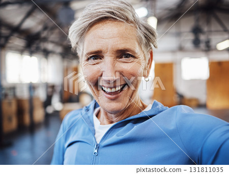 Selfie, smile and fitness senior woman taking picture in the gym after exercise, workout or training having fun. Elderly, old and portrait of fit female happy for wellness and health on social media Selfie, smile and fitness senior woman taking picture in the gym after exercise, workout or training having fun. Elderly, old and portrait of fit female happy for wellness and health on social media 131811035
