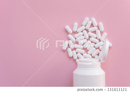 Much medical pills and drugs in white bottle on the pink background. Healthcare concept. Space for text. Much medical pills and drugs in white bottle on the pink background. Healthcare concept. Space for text. 131811121
