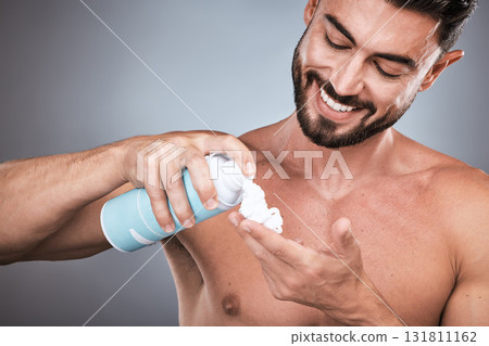 Hands, shaving cream and man with product in studio isolated on a gray background for hair removal. Skincare, face and happy male model with facial foam to shave for epilation, health and hygiene. 131811162