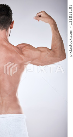 Fitness, health or strong man flexing muscle after exercise, training or gym workout for body goals. Sports motivation, back view or healthy bodybuilder athlete with biceps muscles isolated in studio Fitness, health or strong man flexing muscle after exercise, training or gym workout for body goals. Sports motivation, back view or healthy bodybuilder athlete with biceps muscles isolated in studio 131811193
