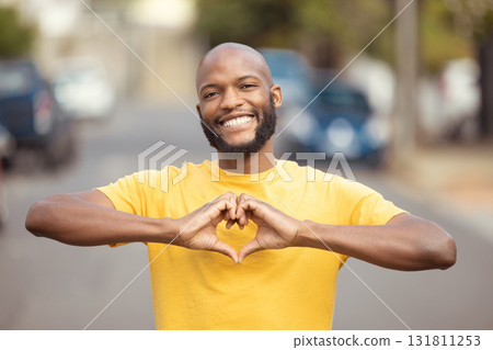 Portrait, man and hand, heart and love in a city, happy and smile against blurred background space. Emoji, hands and face of male relax with finger, frame and loving message, gesture and travel sign Portrait, man and hand, heart and love in a city, happy and smile against blurred background space. Emoji, hands and face of male relax with finger, frame and loving message, gesture and travel sign 131811253