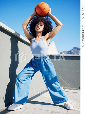 Basketball model, fashion and black woman in city with confidence, feminist and armpit hair. Sports, fitness and portrait of girl outdoors with ball in trendy outfit, urban style and edgy clothes 131811378