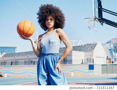 Basketball court, fashion and portrait of black woman in city with attitude, urban style and trendy clothes. Sports, fitness park and girl model outdoors with ball for leisure, confident and stylish 131811387