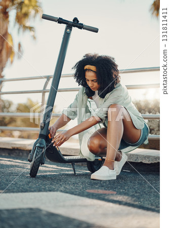 Black woman, ebike and sustainable travel in city, adventure and fix or park scooter outdoor. Eco friendly transportation, freedom with carbon footprint and transport in urban street in Miami Black woman, ebike and sustainable travel in city, adventure and fix or park scooter outdoor. Eco friendly transportation, freedom with carbon footprint and transport in urban street in Miami 131811411