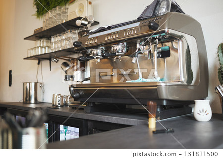 Closeup cafe, coffee and machine equipment in small business, beverage shop or retail. Backgrounds of barista services, drinks machinery and restaurant store of premium espresso, cappuccino and latte 131811500