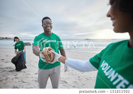 Teamwork, help and recycling with people on beach for sustainability, environment and eco friendly. Climate change, earth day and nature with volunteer and cleaning for charity and community service 131811502