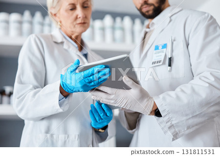 Science, research and team with tablet in laboratory for tests results, medical report and study. Health, biotechnology and scientists with digital tech for data analysis, investigation and analytics 131811531