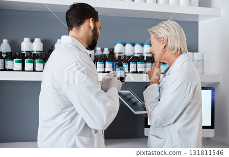 Science, medicine and team with tablet in laboratory for vaccine, medical report and research. Pharmacy, healthcare and scientists reading label of medication for data analysis, results and study 131811546