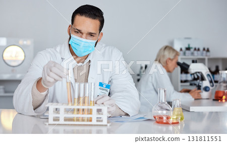 Scientist man, test tube and laboratory for covid 19 research for goal with mask at pharma company. Science team, data analytics and biotech with ppe, vision and medical study with microscope in lab 131811551