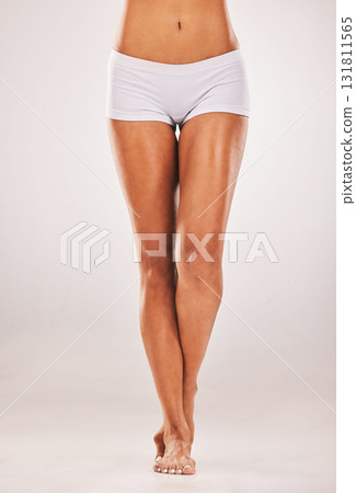 Legs, woman and beauty in studio for skin, cosmetics and grooming against white background space. Feet, smooth and leg of girl model relax on mockup for smooth, perfect and luxury skincare isolated Legs, woman and beauty in studio for skin, cosmetics and grooming against white background space. Feet, smooth and leg of girl model relax on mockup for smooth, perfect and luxury skincare isolated 131811565