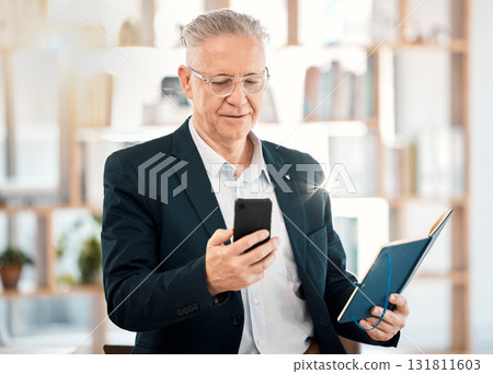 Notebook, phone and senior business man in office for client contact, reading directory and planning schedule. Social media, networking and ceo on smartphone for mobile app, writing email and text Notebook, phone and senior business man in office for client contact, reading directory and planning schedule. Social media, networking and ceo on smartphone for mobile app, writing email and text 131811603