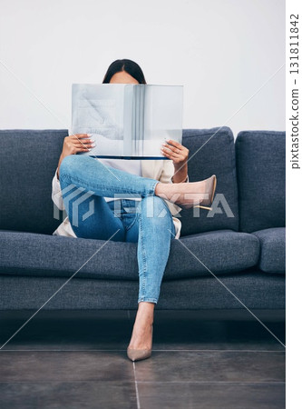 Relax, magazine or girl reading newspaper articles on sofa at home for information or story updates. Press, focus or woman relaxing and studying abstract art for knowledge in a publication on couch Relax, magazine or girl reading newspaper articles on sofa at home for information or story updates. Press, focus or woman relaxing and studying abstract art for knowledge in a publication on couch 131811842